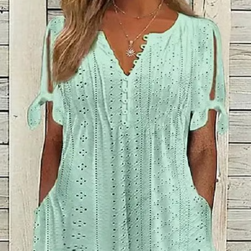 đ„đNĆi elegĂĄns V-nyakĂș ĂŒreges egyszĂnƱ ruha